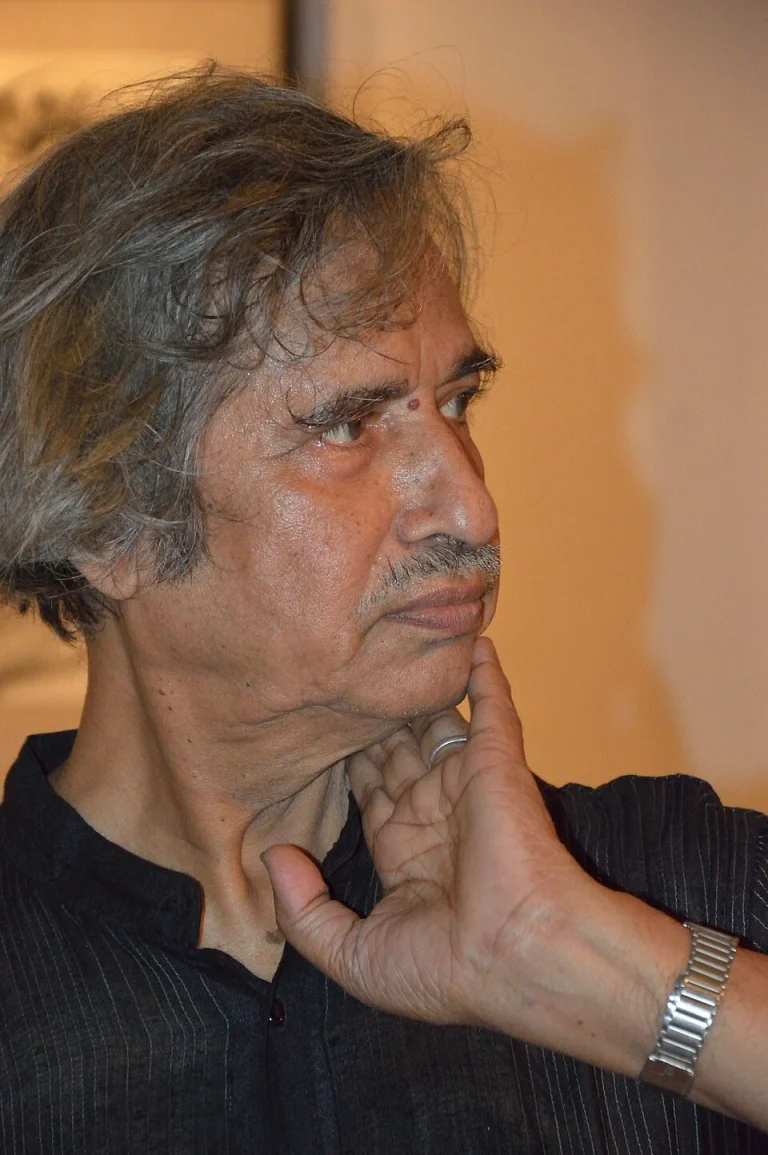Jogen Chowdhury in profile with his hand against his face at a Kolkata art event in 2012