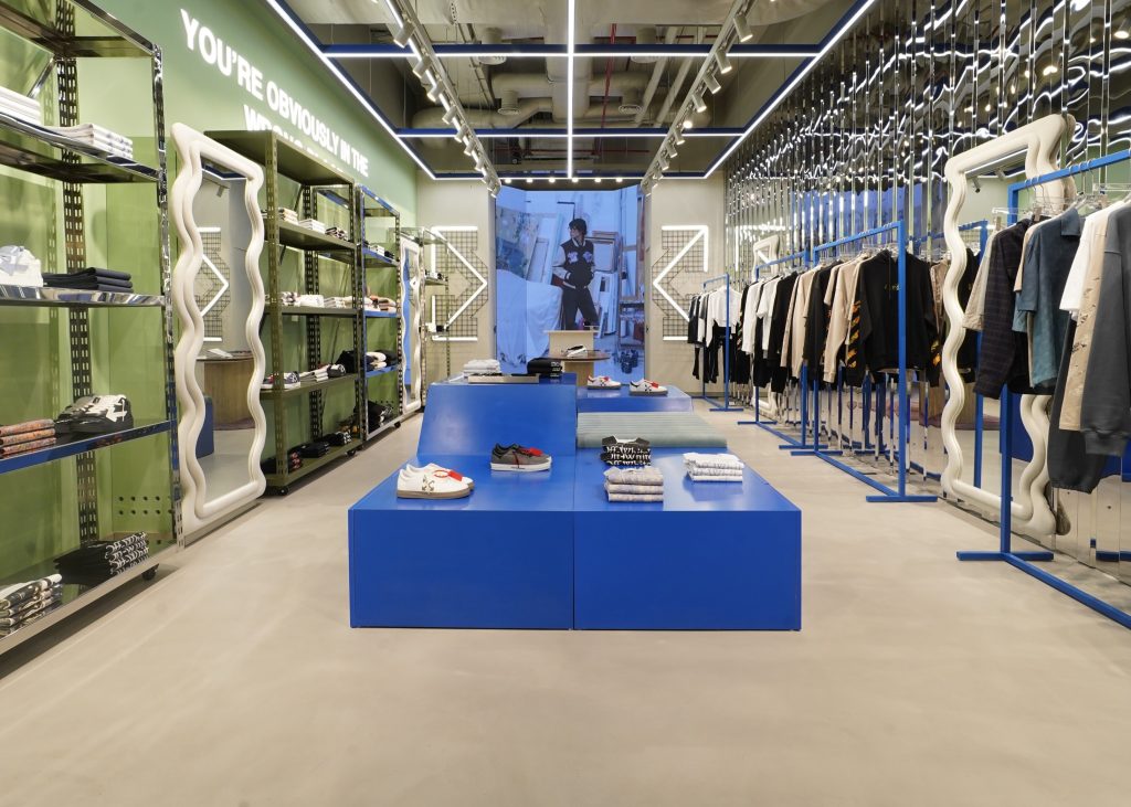 Blue display tables and contemporary industrial interior of Off-White at Quest Mall Kolkata